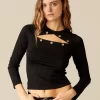 NÍCOLI CAMISETA TACHAS NEGRA< Camisetas | Tops
