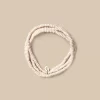NÍCOLI Collar largo bolitas crudo< Collares | Collares