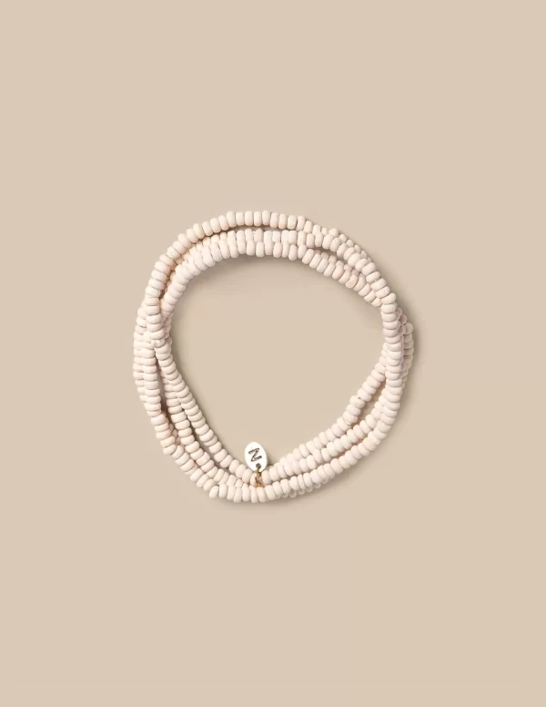 NÍCOLI Collar largo bolitas crudo< Collares | Collares