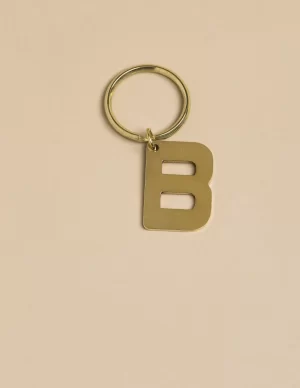 NÍCOLI LLAVERO 'B' DORADO< Llaveros | Llaveros