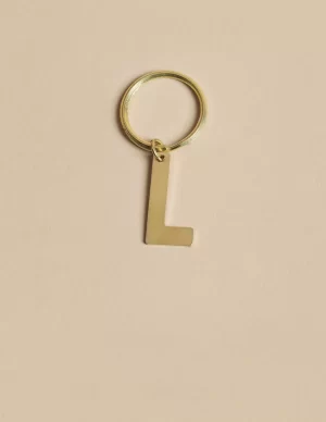 NÍCOLI LLAVERO 'L' DORADO< Llaveros | Llaveros
