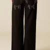 NÍCOLI PANTALÓN VAQUERO NEGRO MIX TACHUELAS< Denim | Pantalones